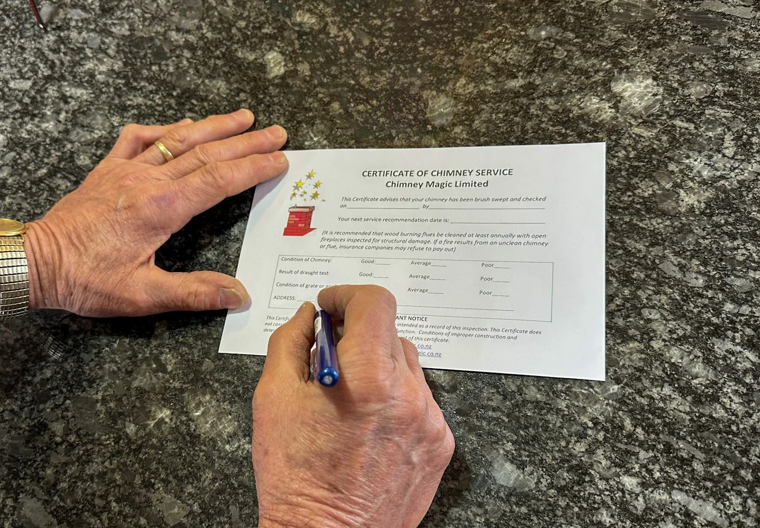 Alan filling in a wood burner service safety-certificate